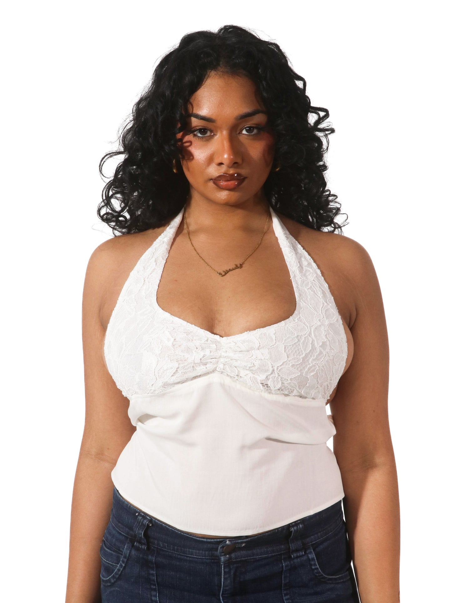 Model wearing a white lace halter top from Yasmin The Label featuring adjustable ties at the top and back; delicate design shown on model who is an Australian size 10-12 and wears M/L.